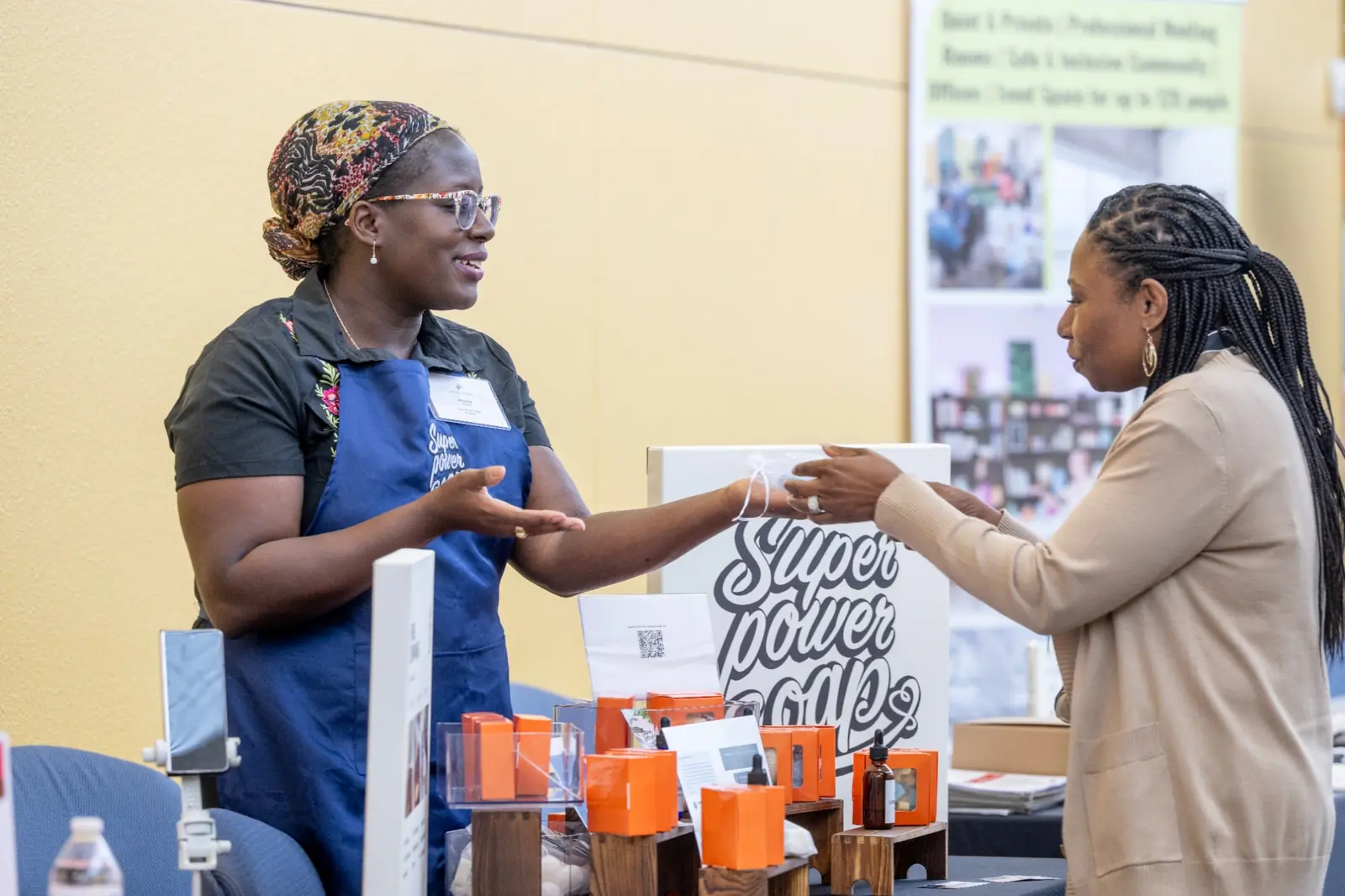Occasion Image: Houston Women’s Organizations Priscilla M. Mensah talking with an attendee at a Houston women’s event