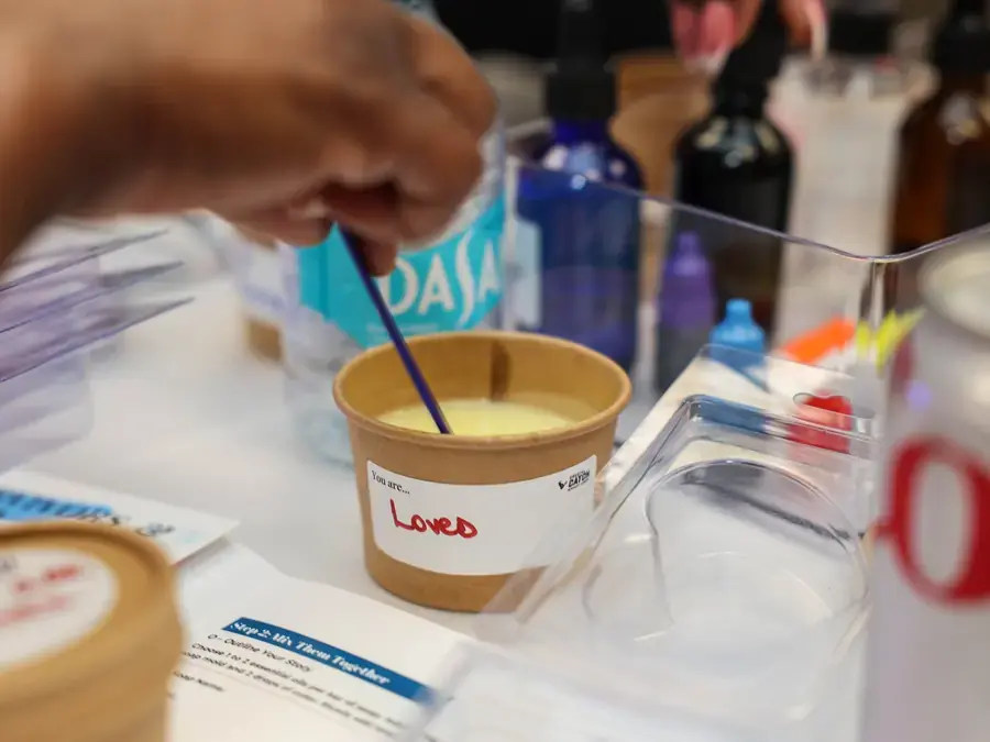 Process Image: Mix Participant mixing a custom soap during a Houston team-building workshop
