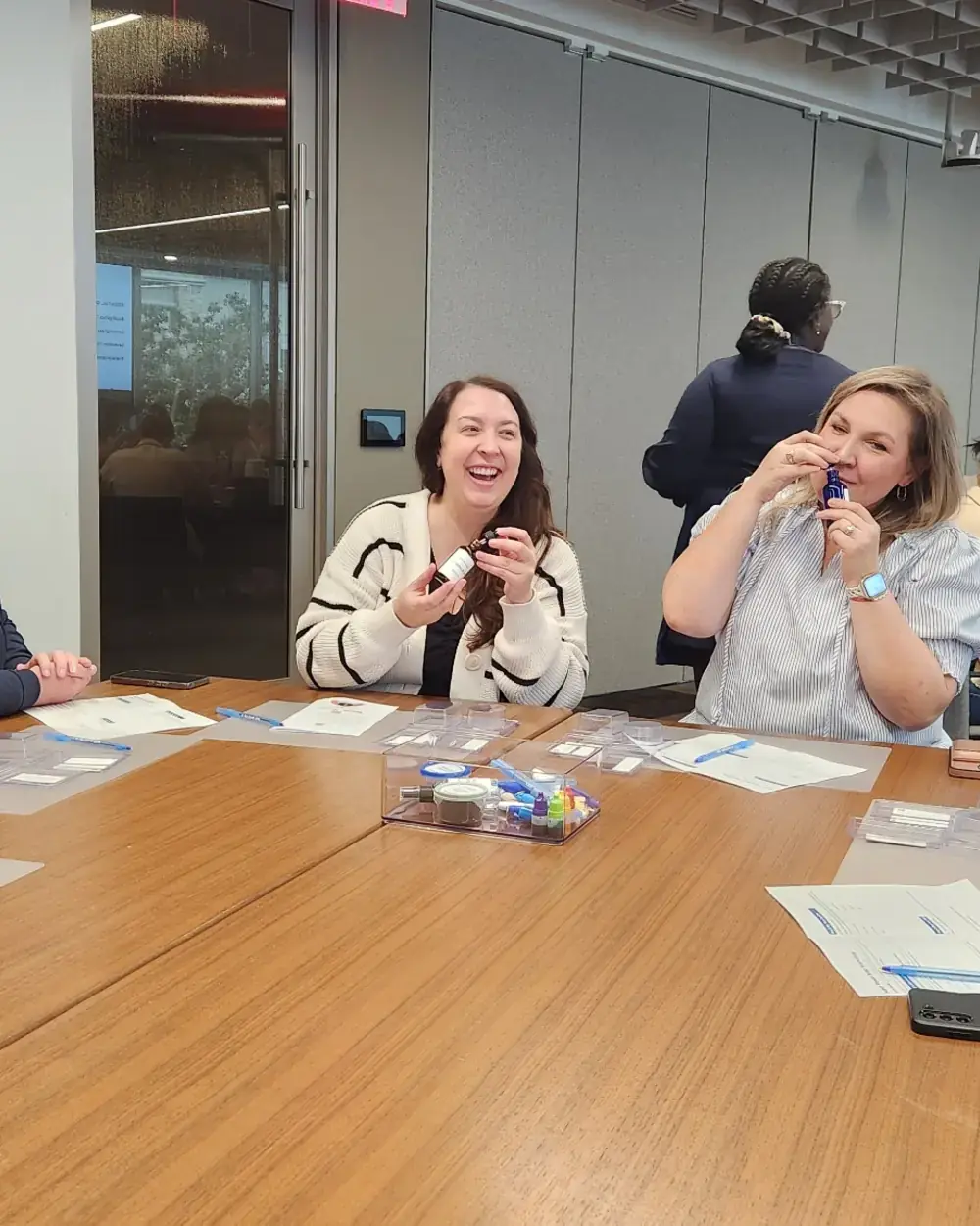 Hero Image Houston colleagues laughing together during an onsite Super Power Soap team-building workshop