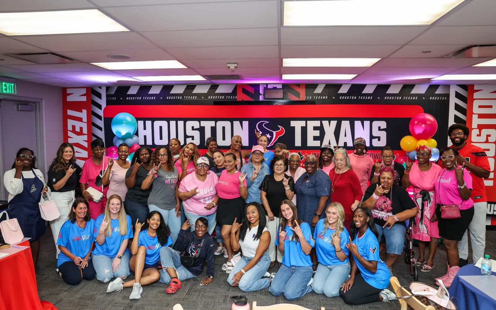 A large group gathered after a Houston Texans Foundation soapmaking experience.